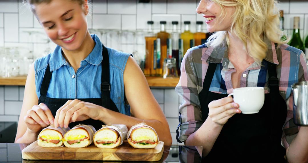 Female Baristas Preparing Sandwiches and Making Coffee in Cafe - Free Images, Stock Photos and Pictures on Pikwizard.com