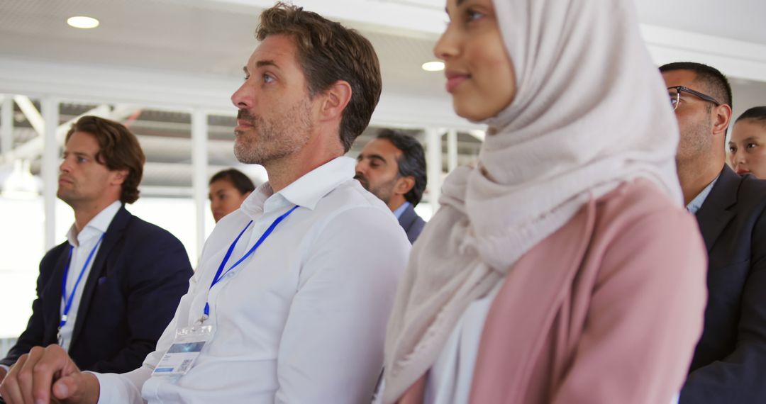 Diverse Professionals in Seminar Setting with Focused Engagement