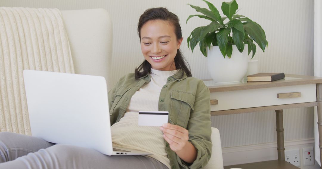 Woman Shopping Online with Credit Card on Couch at Home - Free Images, Stock Photos and Pictures on Pikwizard.com