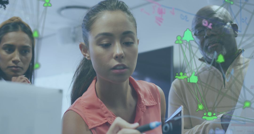 Mixed Group Collaborating with Futuristic Technology in Modern Office