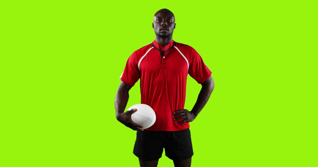 Confident Rugby Player in Red Jersey Holding Ball on Green Screen Background - Free Images, Stock Photos and Pictures on Pikwizard.com