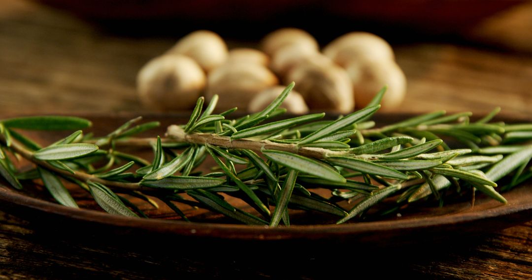 Close-Up of Fresh Rosemary Herb on Wooden Plate - Free Images, Stock Photos and Pictures on Pikwizard.com