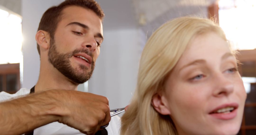 Skilled Barber Trimming Client's Hair in Stylish Salon - Free Images, Stock Photos and Pictures on Pikwizard.com