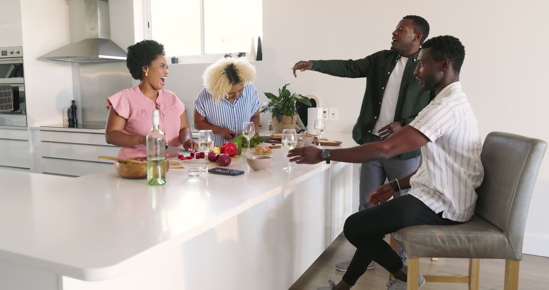 Diverse Friends Laughing and Enjoying Drinks Around Kitchen Island