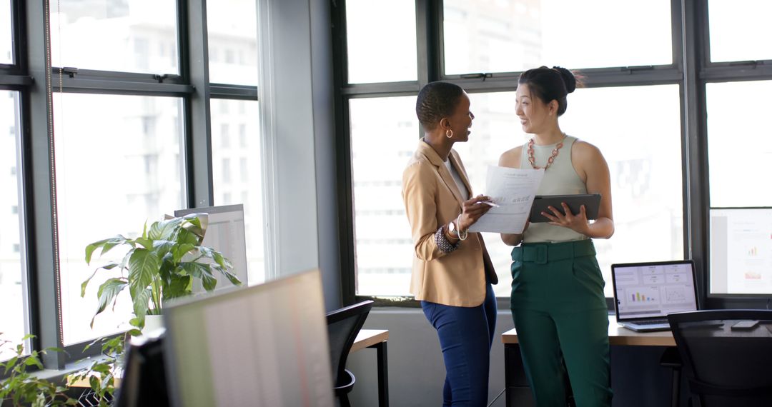 Casual Business Teamwork Discussion in Bright Office