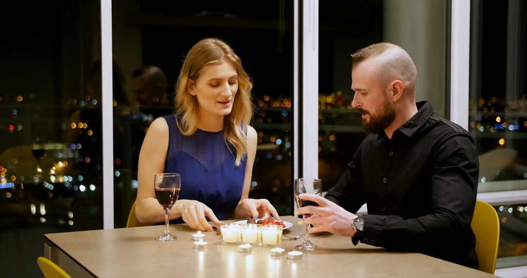 A Caucasian couple enjoys a romantic dinner by candlelight, with copy space - Free Images, Stock Photos and Pictures on Pikwizard.com