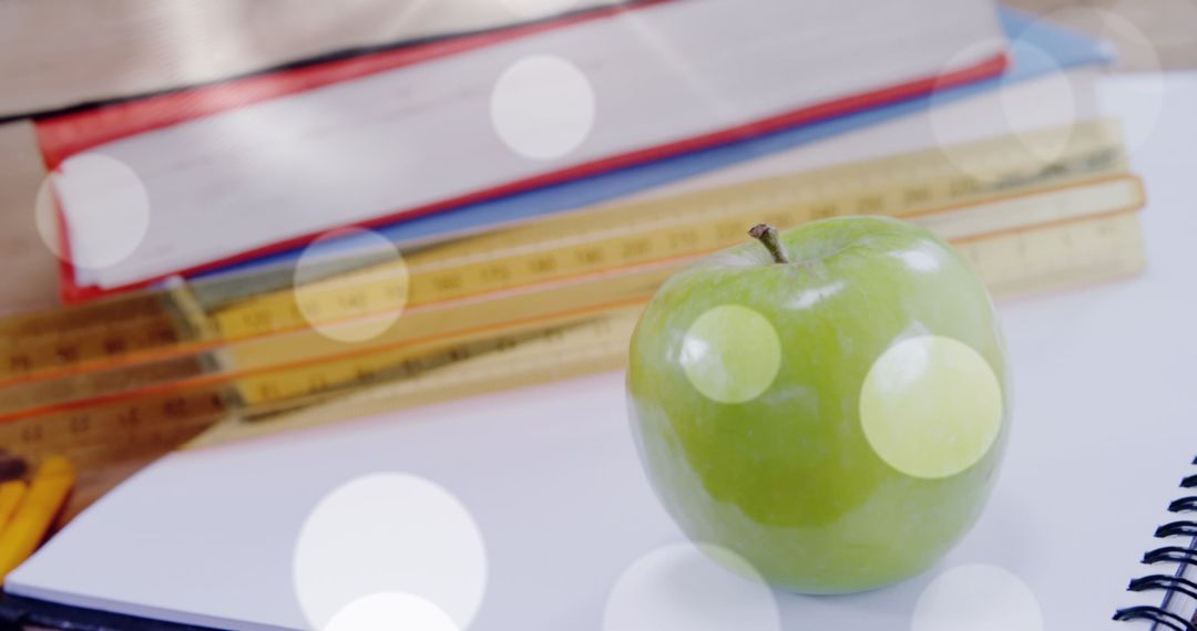 Literacy Concept with Green Apple and School Supplies