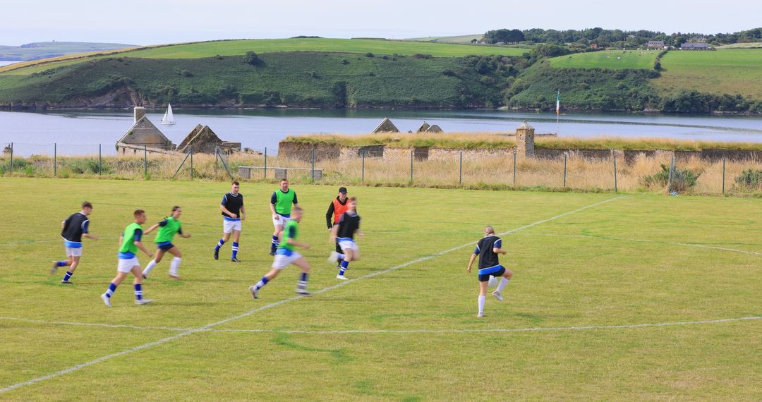 Athletes Training in Scenic Coastal Field with Idyllic Backdrop