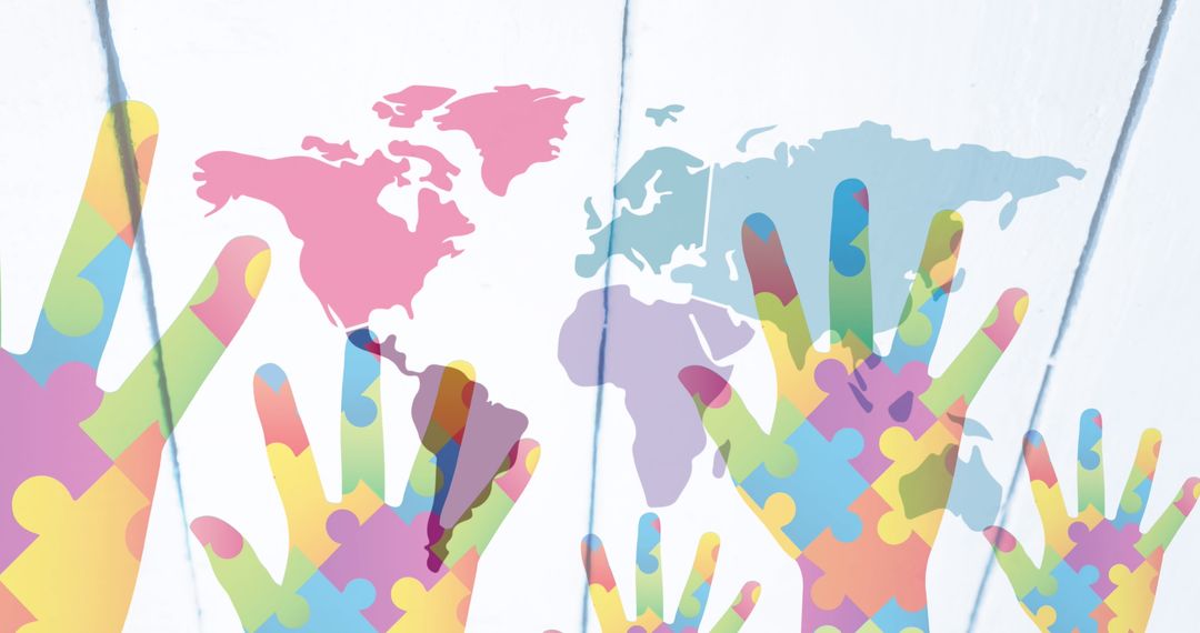 Colorful Puzzle Hands on World Map: Global Autism Awareness Concept