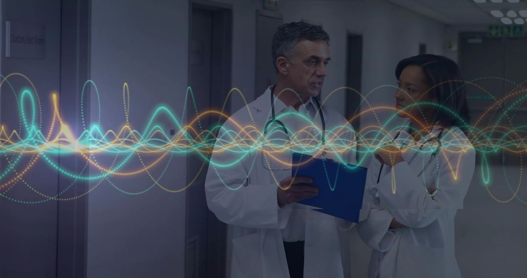 Doctors Collaborating in Hospital Corridor with Innovative Technology