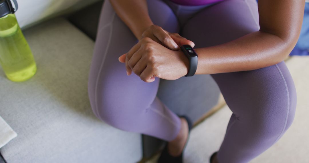 Close-Up of Athlete Using Fitness Tracker While Resting - Free Images, Stock Photos and Pictures on Pikwizard.com