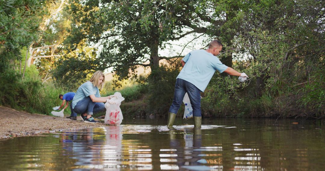 Group of Volunteers Cleaning Riverbank and Collecting Waste - Free Images, Stock Photos and Pictures on Pikwizard.com