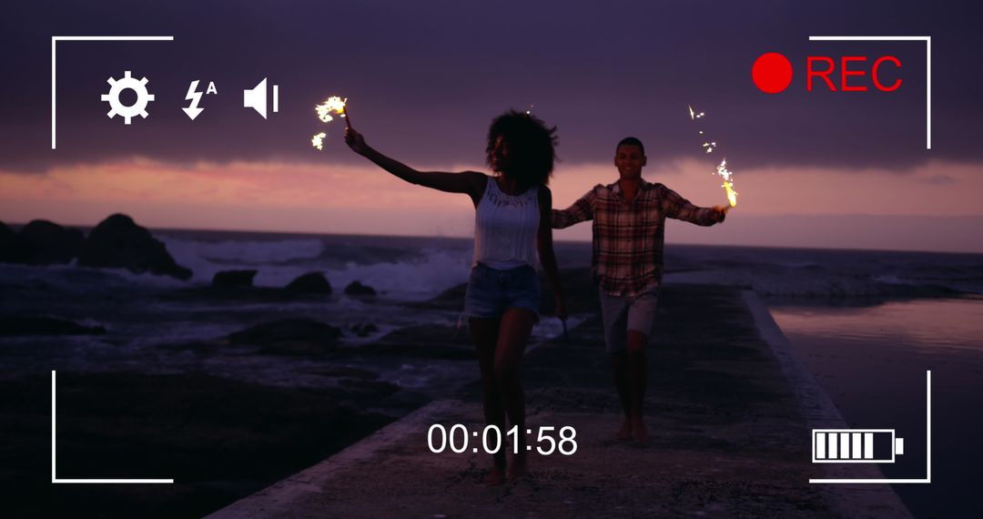 Couple Enjoying Fireworks on Beach at Night Frame Preview