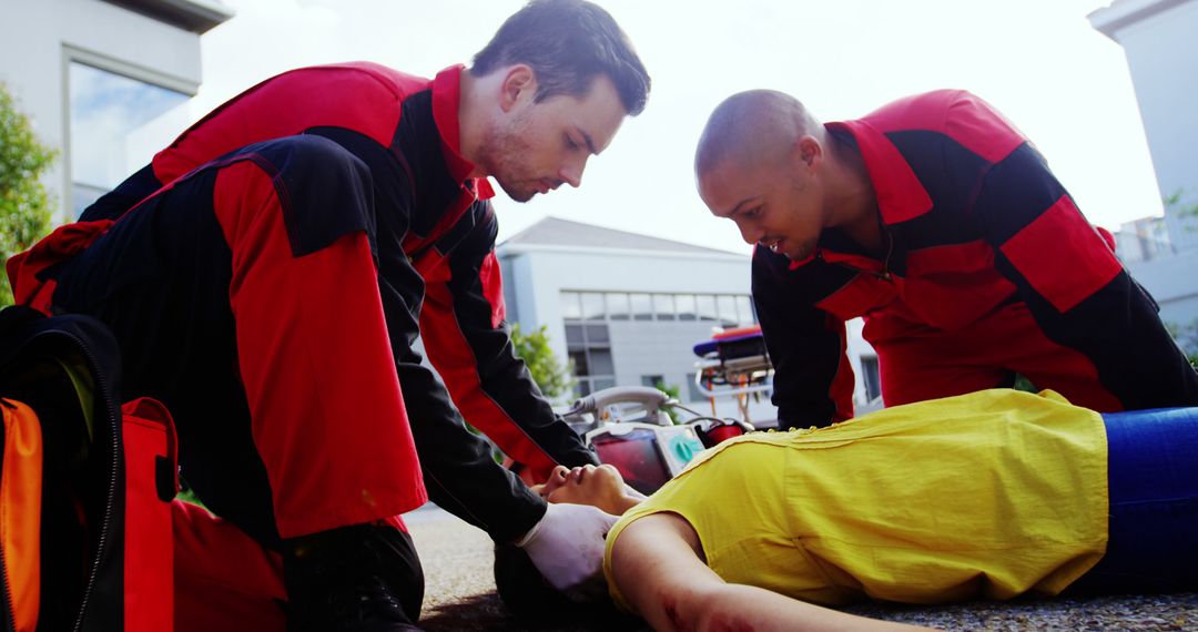 Emergency Medical Technicians Assisting Injured Person Outdoors - Free Images, Stock Photos and Pictures on Pikwizard.com