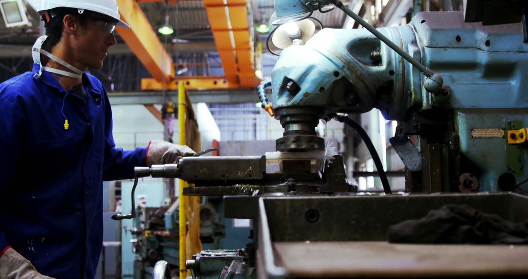 Industrial Worker Operating Heavy Machinery in Factory Setting - Free Images, Stock Photos and Pictures on Pikwizard.com