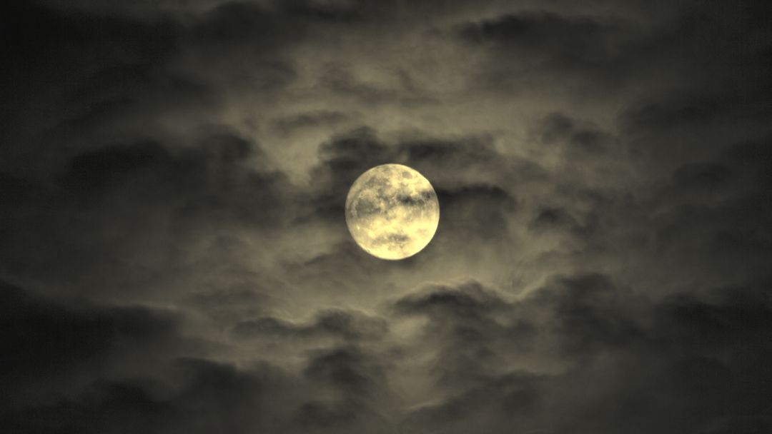 Full Moon Glowing Amidst Dark Clouds at Night - Free Images, Stock Photos and Pictures on Pikwizard.com