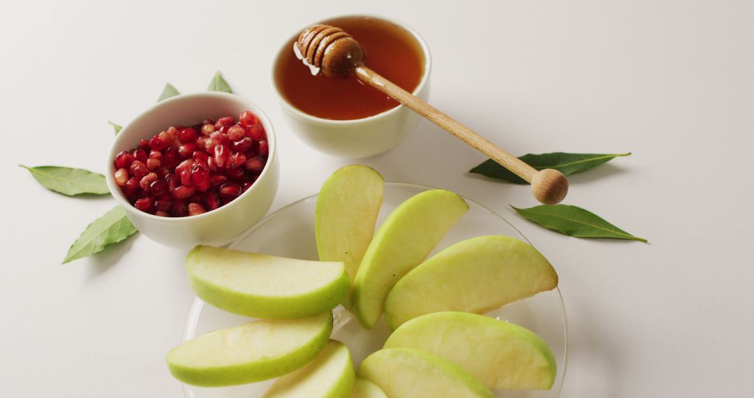 Fresh Apple Slices with Honey and Pomegranate Seeds