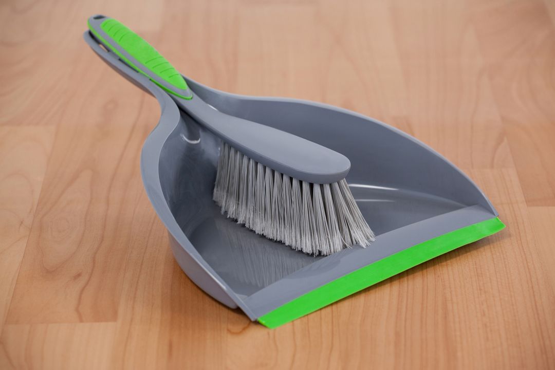Close-up of Dustpan and Sweeping Brush on Wooden Floor - Free Images, Stock Photos and Pictures on Pikwizard.com