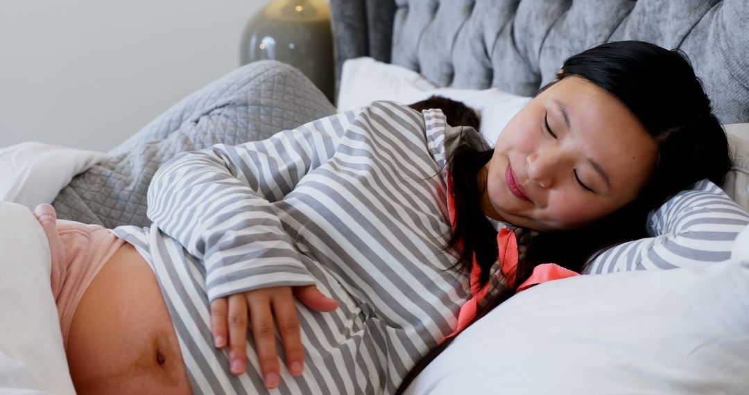 Pregnant Woman Resting Peacefully at Home beside Spouse