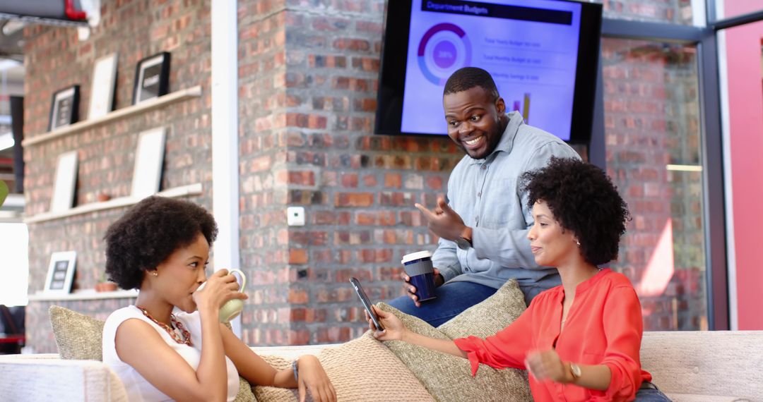 Diverse Coworkers Collaborating in Modern Lounge Workspace