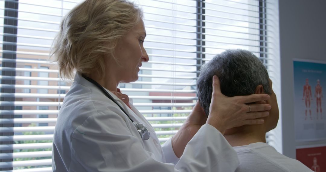 Doctor Examining Patient's Neck in Clinical Setting - Free Images, Stock Photos and Pictures on Pikwizard.com