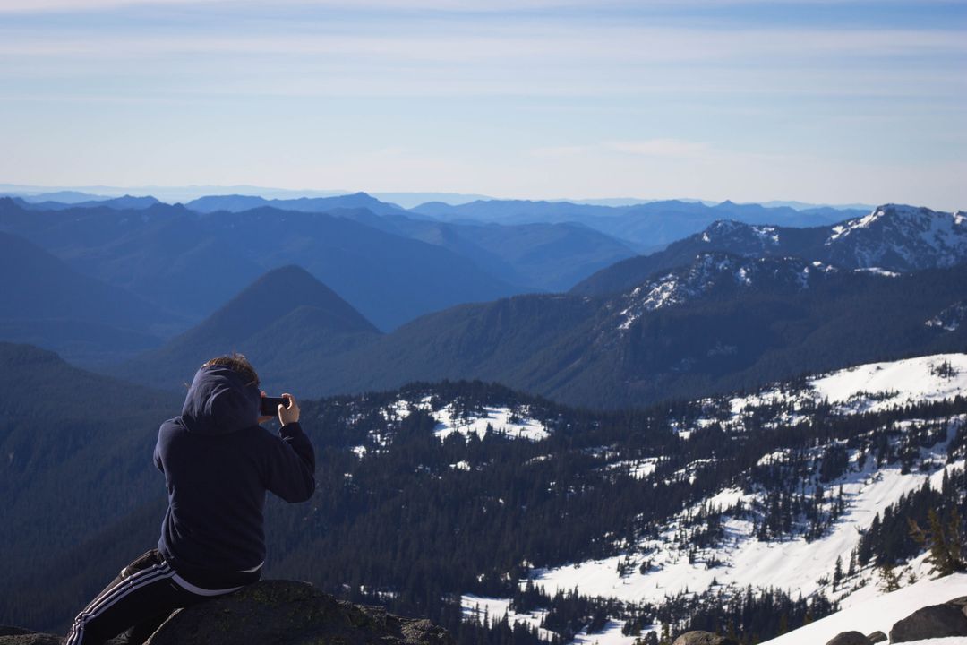 Person Photographing Scenic Mountain View - Free Images, Stock Photos and Pictures on Pikwizard.com