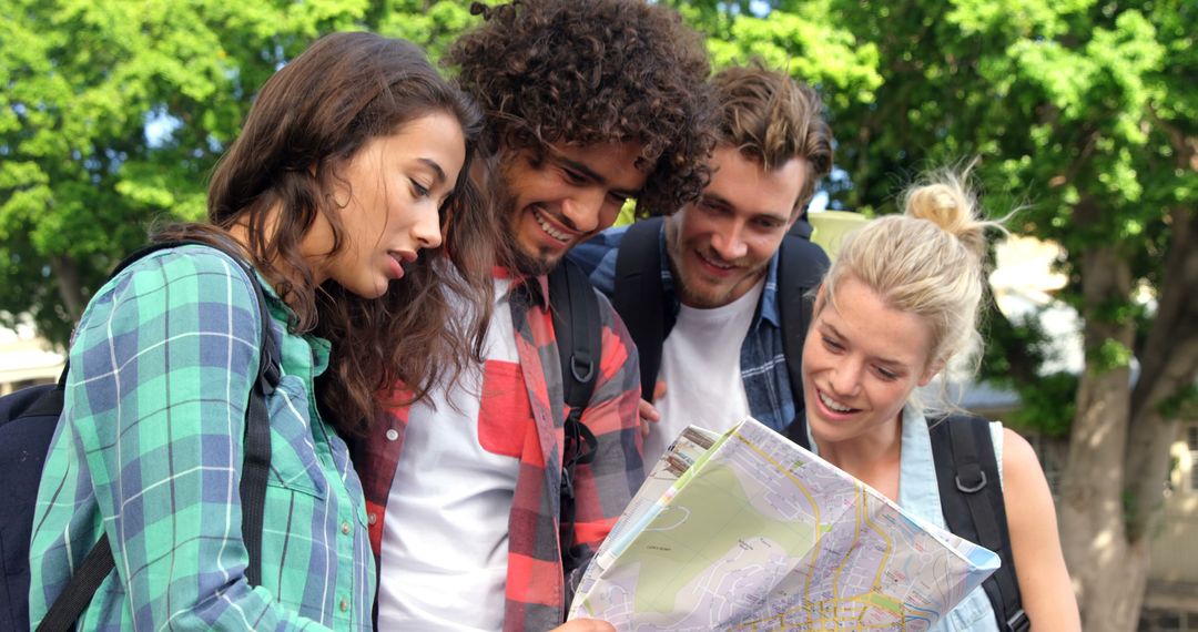 Diverse Friends Exploring with a Map on Sunny Day