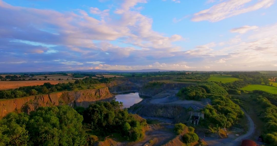 Aerial View of Idyllic Countryside with Quarry Lake at Sunset - Free Images, Stock Photos and Pictures on Pikwizard.com