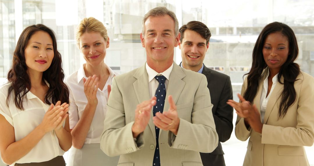 Diverse Business Team Clapping Together at the Office - Free Images, Stock Photos and Pictures on Pikwizard.com