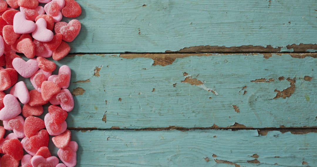 Colorful Heart-Shaped Candy on Rustic Blue Wooden Table