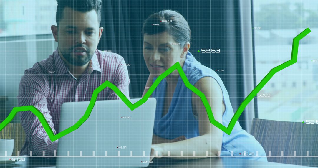 Business Professionals Analyzing Financial Data on Laptop with Graph Overlay - Free Images, Stock Photos and Pictures on Pikwizard.com