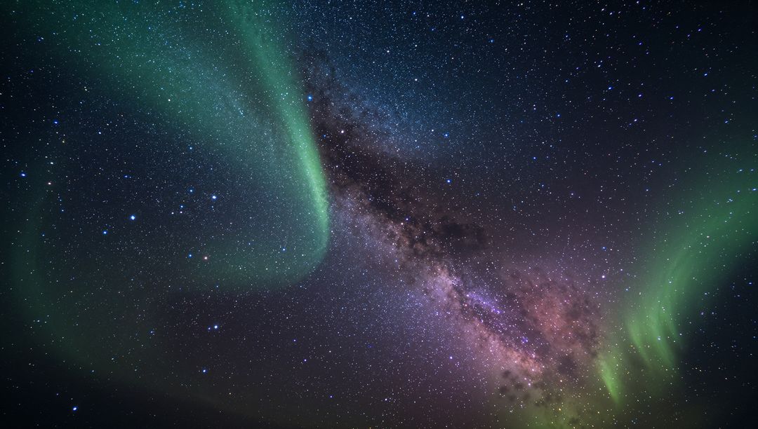 Emerald Aurora Dancing Across Milky Way Galactic Core Over Arctic Starfield