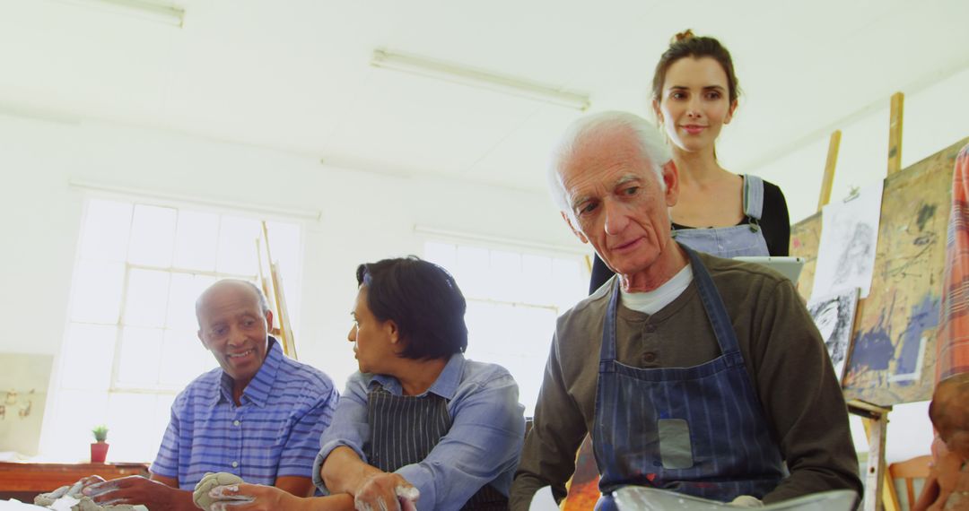 Diverse Group of Adults Enjoying Creative Painting Class