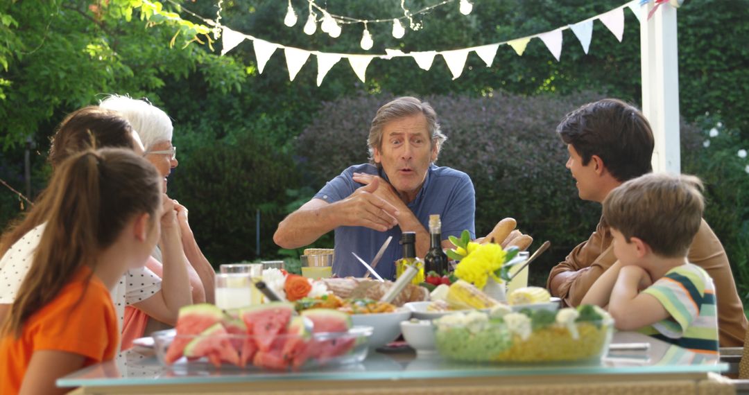 Family Enjoying Outdoor Dining in Sunny Garden - Free Images, Stock Photos and Pictures on Pikwizard.com