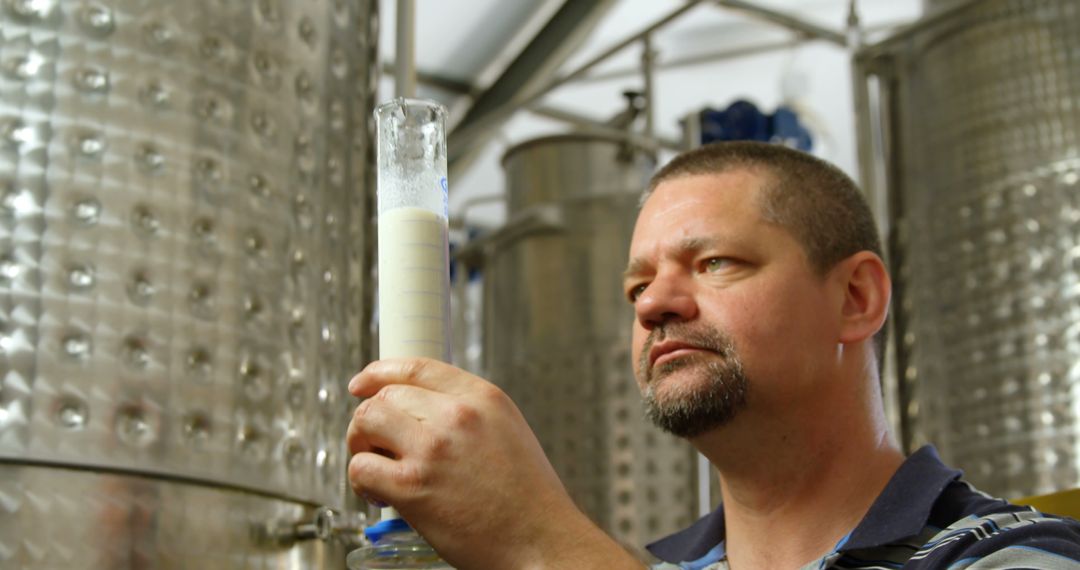 Scientist Analyzing Liquid in Laboratory - Free Images, Stock Photos and Pictures on Pikwizard.com