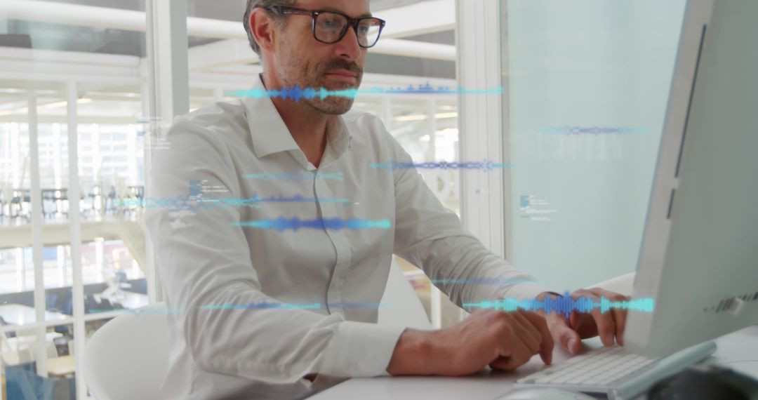 Middle Aged Businessman Using Technology in Modern Office