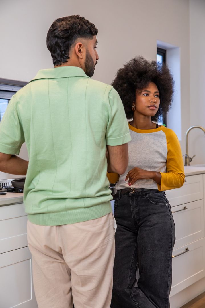 Modern Couple Preparing Meal in Minimalist Kitchen