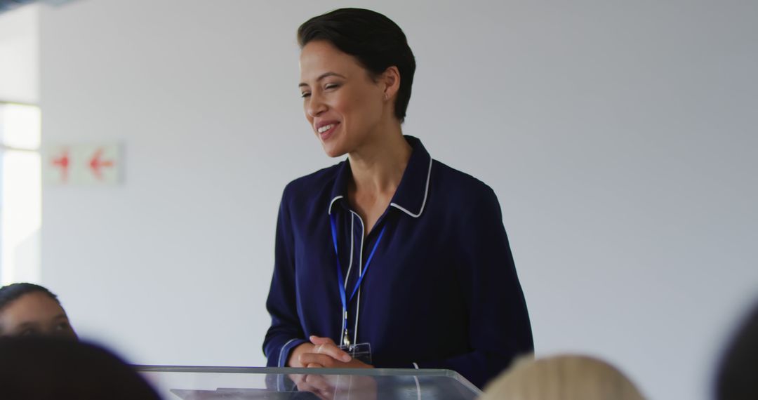 Businesswoman Smiling While Giving Conference Speech - Free Images, Stock Photos and Pictures on Pikwizard.com