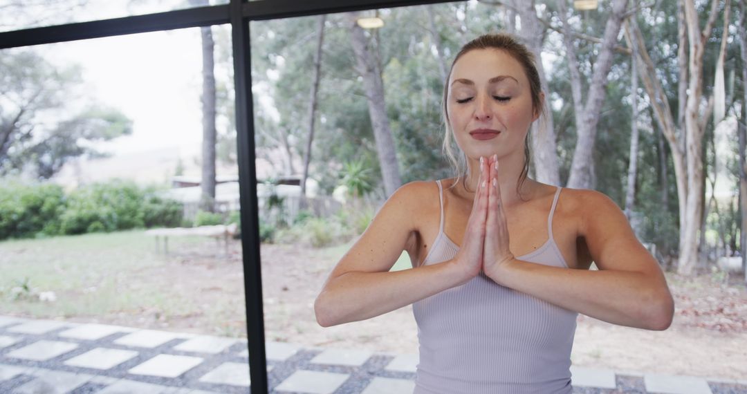 Woman Practicing Yoga Meditation Indoors Near Window - Free Images, Stock Photos and Pictures on Pikwizard.com