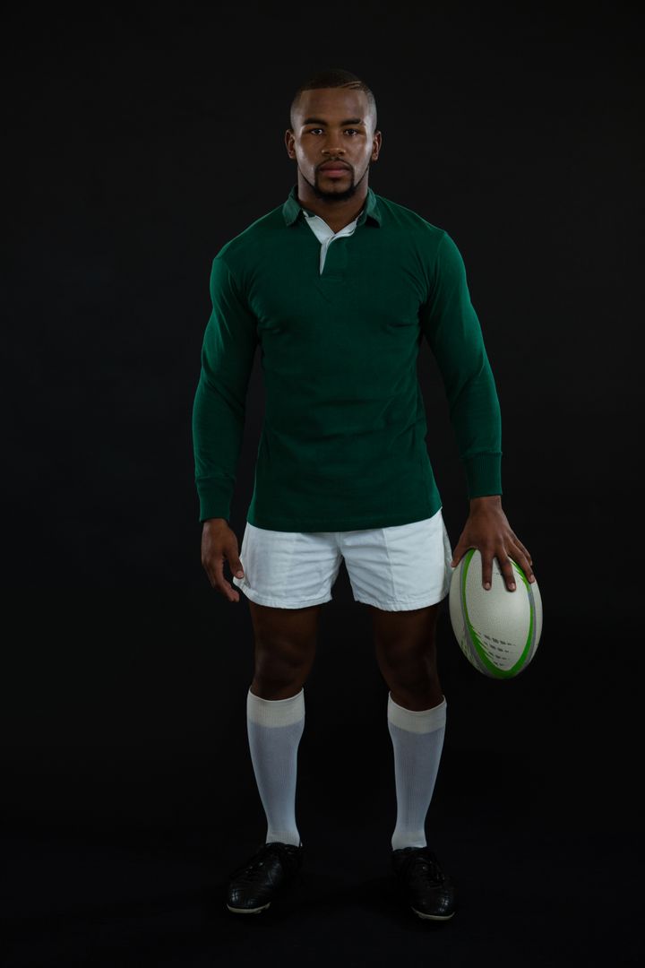 Portrait of male rugby player holding ball - Free Images, Stock Photos and Pictures on Pikwizard.com