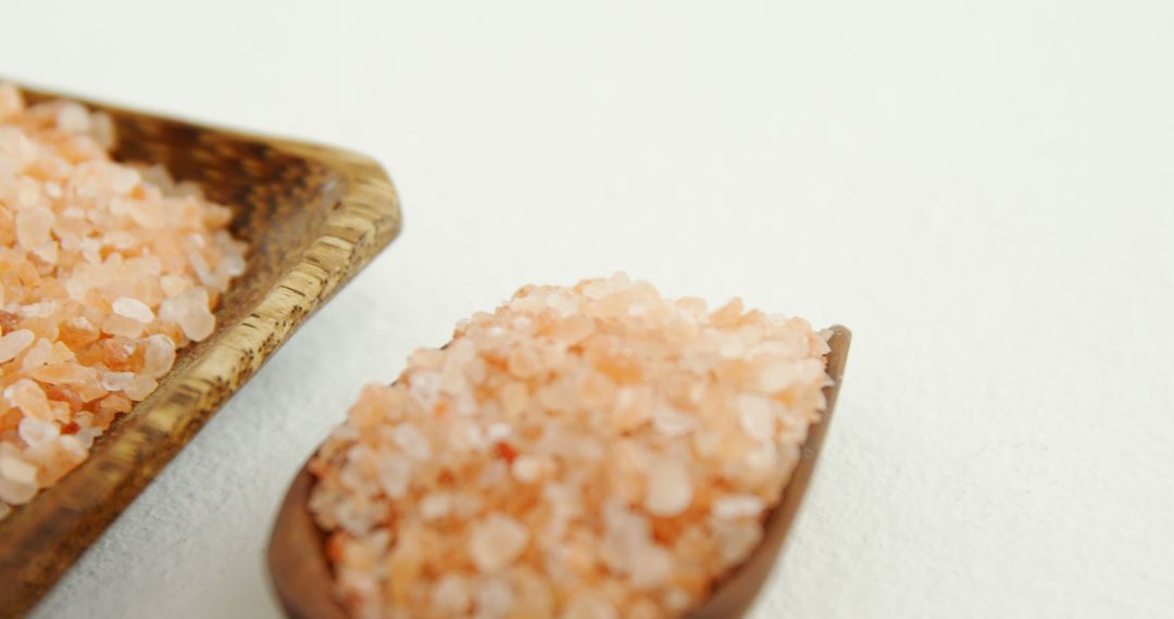 Pink Himalayan Salt Crystals on Wooden Spoon with Copy Space - Free Images, Stock Photos and Pictures on Pikwizard.com