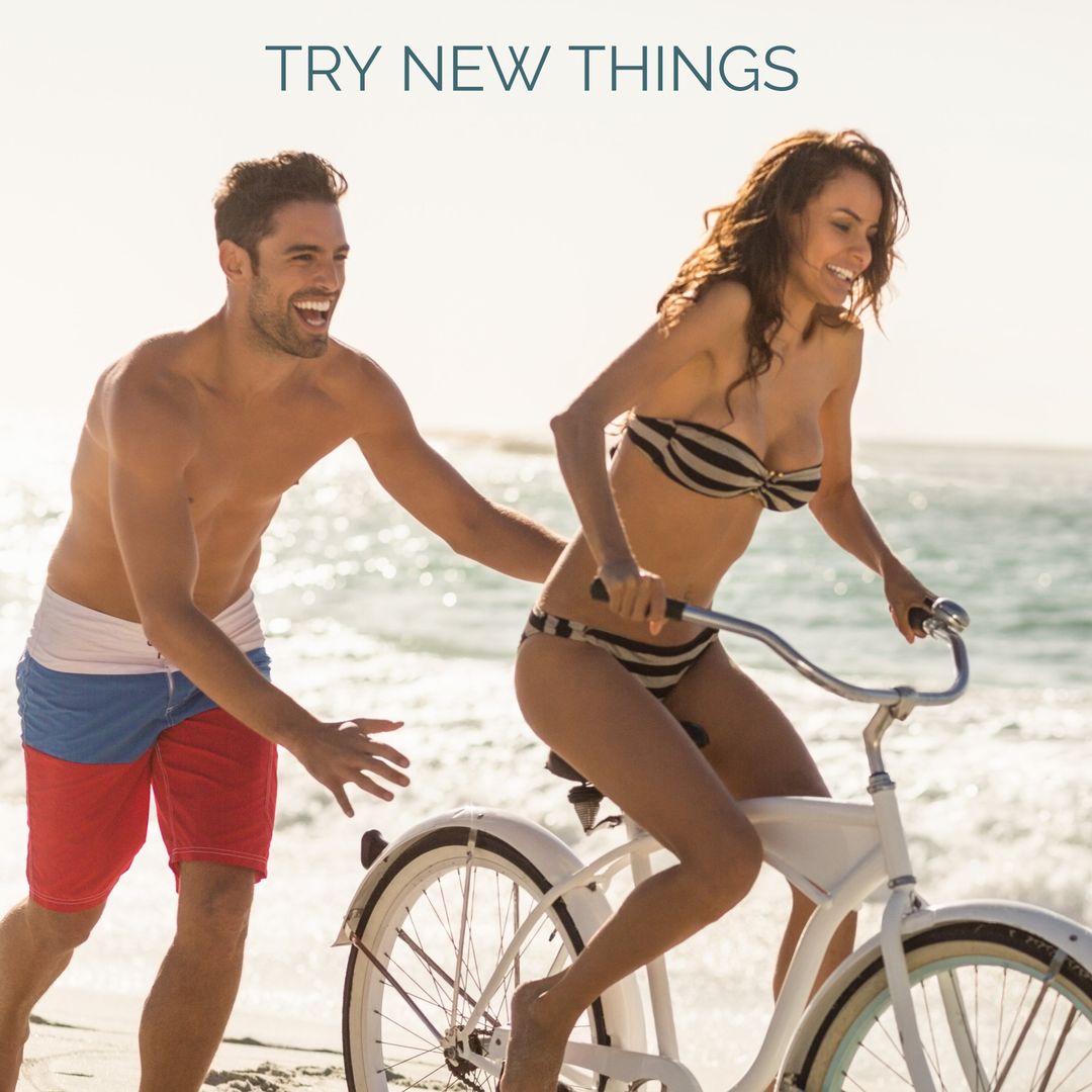 Happy Couple Embracing Adventure on Beach Bicycle Ride