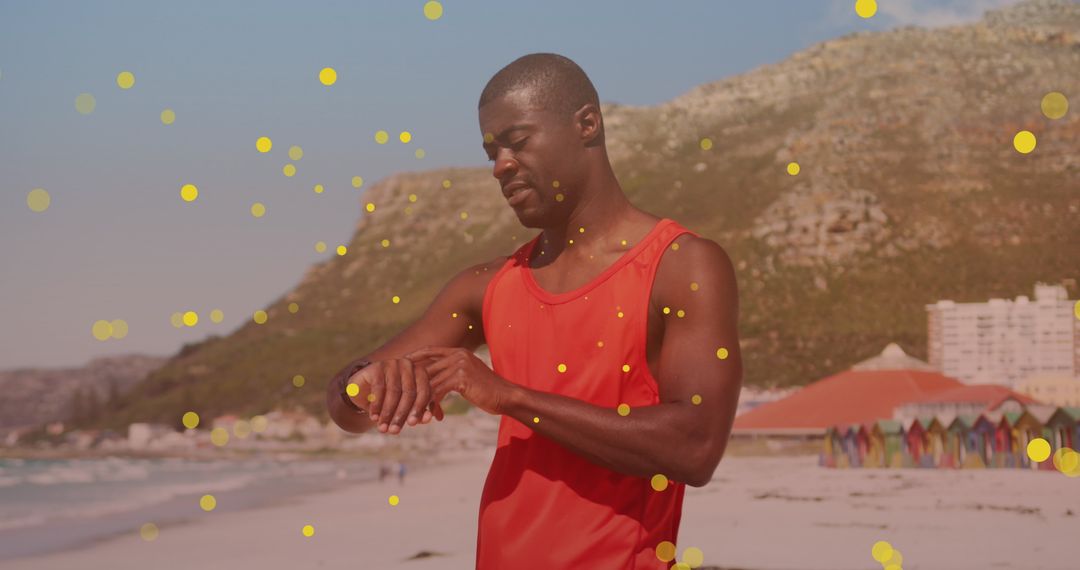 Man Tracking Fitness on Smartwatch at Scenic Beach