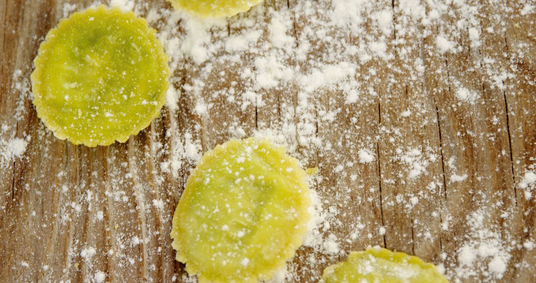 Homemade Spinach Ravioli on Wooden Surface with Flour Dust - Free Images, Stock Photos and Pictures on Pikwizard.com