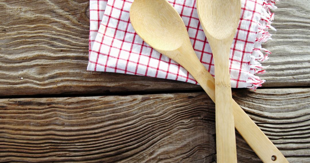 Rustic Wooden Spoons on Checkered Cloth on Wooden Surface - Free Images, Stock Photos and Pictures on Pikwizard.com