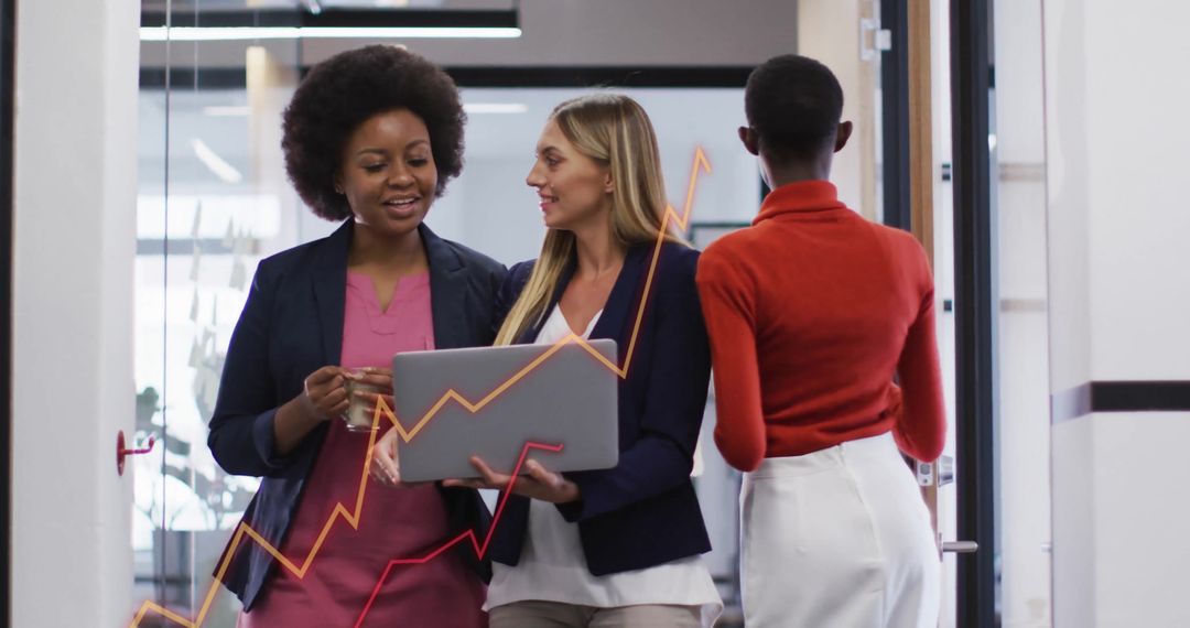 Diverse Business Team Analyzing Data in Modern Office Environment