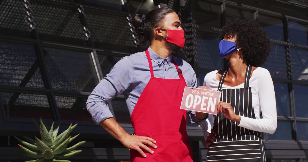 Restaurant Owners Celebrate Business Reopening with Masks - Free Images, Stock Photos and Pictures on Pikwizard.com