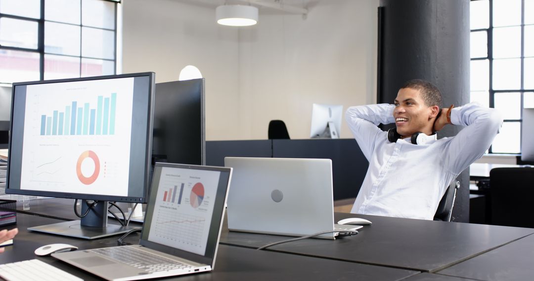 Confident Business Professional Analyzing Data in Modern Office