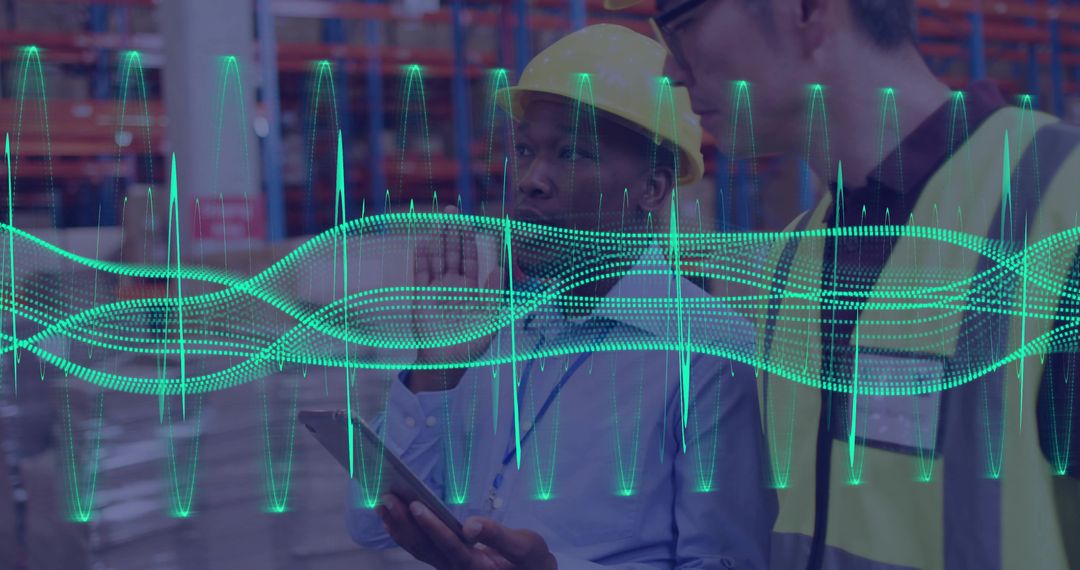 Warehouse staff monitoring sensor analytics on tablet with waveform overlay in logistics aisle