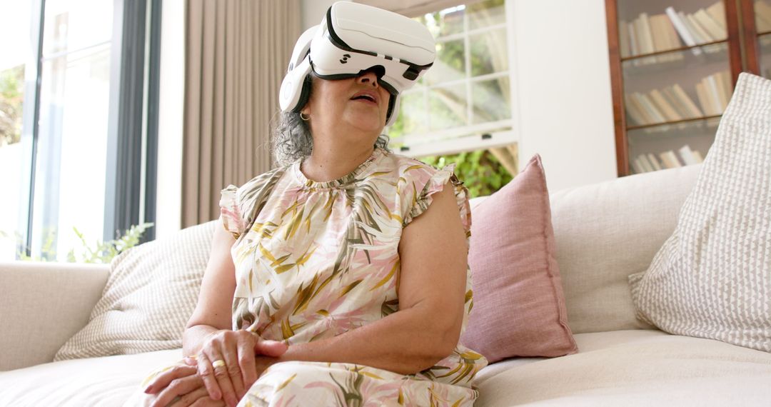 Senior Biracial Woman Exploring VR Technology on Couch